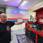 Mechanic Paulie showcasing his organized toolbox drawers