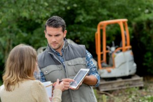 Arborist in the field tracking work