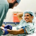 A brain tumor patient gets an IV before his brain surgery.