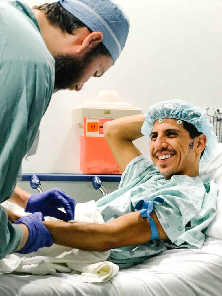 A brain tumor patient gets an IV before his brain surgery.