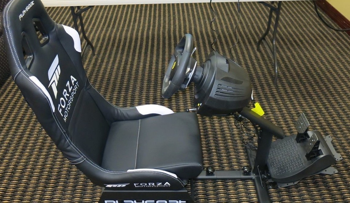 Sim racing setup with Playseat and steering wheel