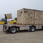 Soldiers prepare equipment for deployment at Fort Drum, New York, showcasing unit movement operations expertise.